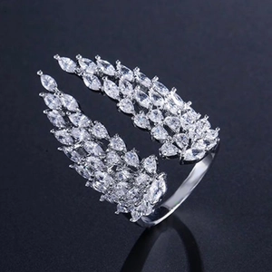 Macro detail of silver wings open ring with pavé marquise and pear zircon stones