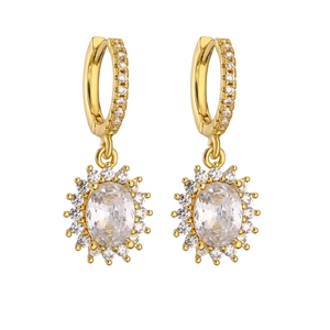 Detail shot of gold-plated hoop earrings with sparkling zircon sunflower pendants
