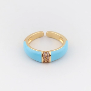 Detail of gold-plated open ring with sky blue enamel and rows of sparkling cubic zirconia