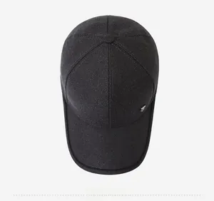 Top view of deep grey baseball cap with textured fabric and small metal logo detail
