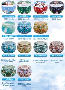 Selection of scented soy candles in colorful patterned metal tins with various floral motifs