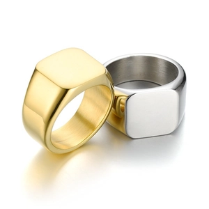 Detailed macro view of square flat top signet rings showing brushed inner metal texture