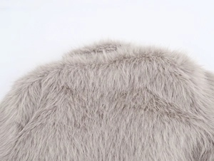 Detail shot of the grey faux fur collar showing soft fluffy texture and premium fiber quality