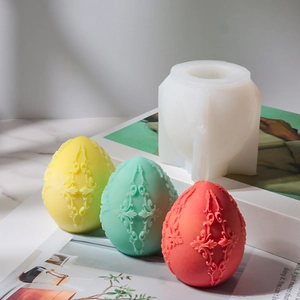 Macro shot of 3D embossed egg candle silicone mold with floral scroll patterns