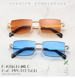 Flat lay of square metal sunglasses in gradient orange and bright blue on marble