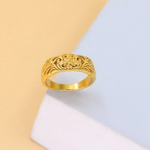 Close-up of vintage 18K gold plated ring featuring intricate floral embossed patterns