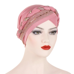 Detailed front view of a pink turban hat with braided trim and gold sequins