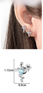 Macro view of silver cross stud earring with blue heart zircon and 1.13cm size detail