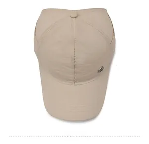 Detailed top view of a light beige quick-dry baseball cap with a metal logo