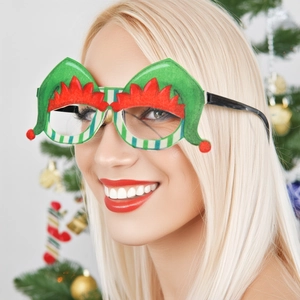 Détail de lunettes lutin de Noël avec monture rayée rouge et blanche pour la fête