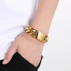 22mm chunky gold Cuban link chain bracelet in polished stainless steel for men on wrist