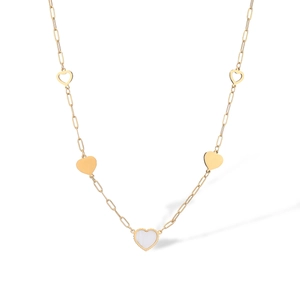 Detail view of gold-plated necklace with shell-inlaid heart charms on white background