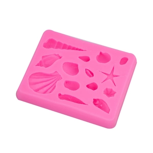Pink silicone marine theme mold featuring various starfish and seashell shapes for cake decor