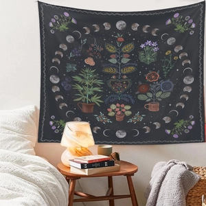 Macro detail of bohemian tapestry showing moon phase and botanical patterns on bedroom wall