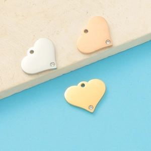 Polished titanium steel heart pendants in silver rose gold and gold with small crystals