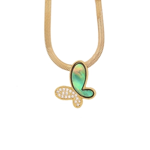 Close-up of golden butterfly pendant with green shell inlay and flat snake chain
