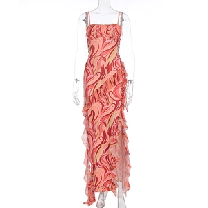 Detail of wave print summer dress showing ruffled hemline and side drawstring slit