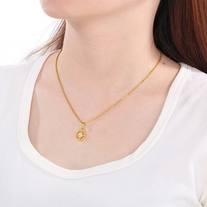 Golden stainless steel necklace with geometric hollow round pendant and clear gemstone