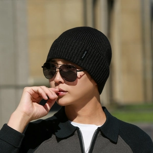 Classic black ribbed knit beanie for men and women featuring a windproof warm design