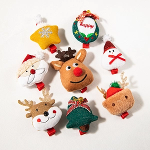 Set of 8 plush Christmas hair clips featuring reindeer, Santa, and tree designs on white