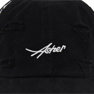 Distressed black cotton baseball cap featuring white Asher embroidery in vintage style