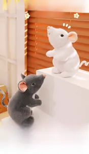 Close-up of soft plush texture on grey and white stuffed mice toys set