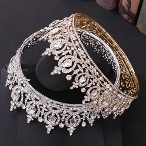 Detailed view of gold and silver bridal crowns featuring rhinestones and crystal hearts