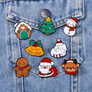 Set of 8 Christmas enamel pins including Santa and reindeer on denim jacket