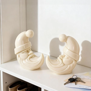 Set of two moon-shaped Santa Claus ceramic ornaments in minimalist Nordic decor style