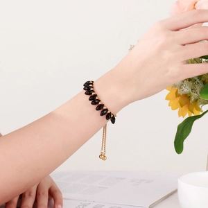 Minimalist pearl and titanium steel bead bracelet with turquoise and diamond cut black beads