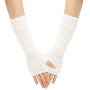 Close-up of white knitted long fingerless gloves with detailed ribbed cuff texture