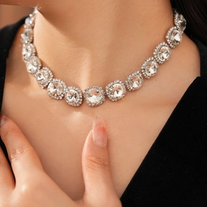 Close-up of sparkling crystal fringe necklace with silver-tone rhinestone settings