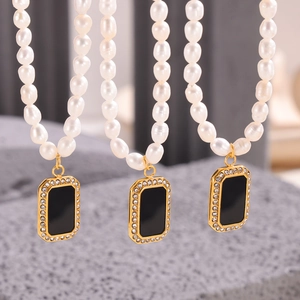Elegant pearl necklace featuring black rectangular pendant with zircon border inlay