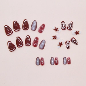 Detail of 3D metallic star patterns and swirls on press-on nails with various finishes