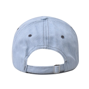 Detailed back view of light blue denim baseball cap featuring an adjustable metal buckle