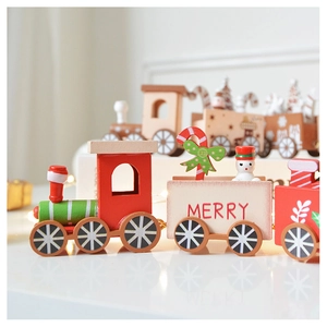 Close-up of wooden Christmas train with snowman and candy cane festive details