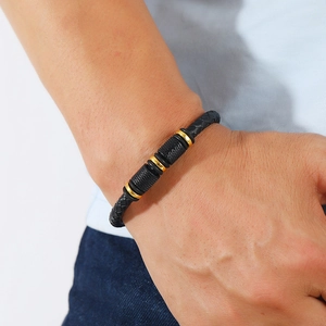 Men's multilayer PU leather woven bracelet with gold magnetic clasp on model's wrist