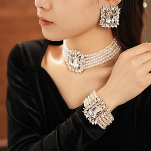 Multi-layer pearl choker necklace set with crystal pendant and matching bracelet