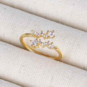 Macro detail of 18K gold-plated adjustable ring with shimmering zircon stones