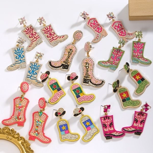 Exaggerated golden alloy cowboy boot earrings with colorful beads and rhinestones