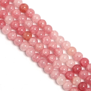 Detailed macro view of round pink strawberry quartz beads for DIY jewelry making