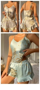 Detailed view of V-neck satin floral pajama set with ruffled hem and smooth silk-like texture