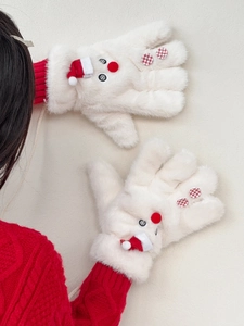 Detail of plush white snowman mittens with red holiday hats and soft faux fur texture