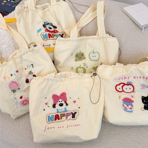 Collection of beige drawstring canvas tote bags with various cute animal embroidery details