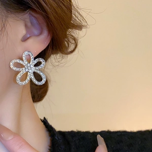 Elegant silver flower stud earrings with sparkling pavé crystals for a luxury women's look