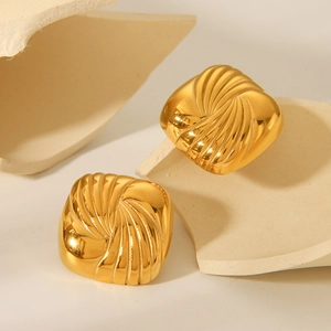 Square gold stainless steel stud earrings with spiral texture on geometric plinth