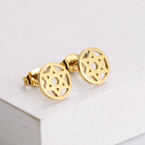 Golden stainless steel hexagram stud earrings on white wooden display for Christmas gifts