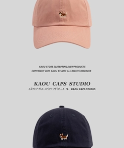 Close-up of cute Corgi embroidery on pink and navy blue cotton twill baseball caps