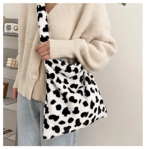 Furry cow print tote bag detail showing soft texture and large capacity for women