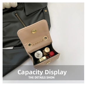 Internal capacity of mini beige crossbody bag showing space for lipstick and perfume